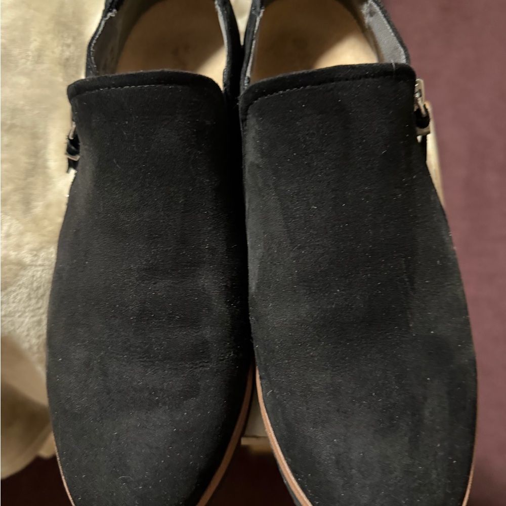 Woman’s black slip on shoes with zippers on the side… lightly worn